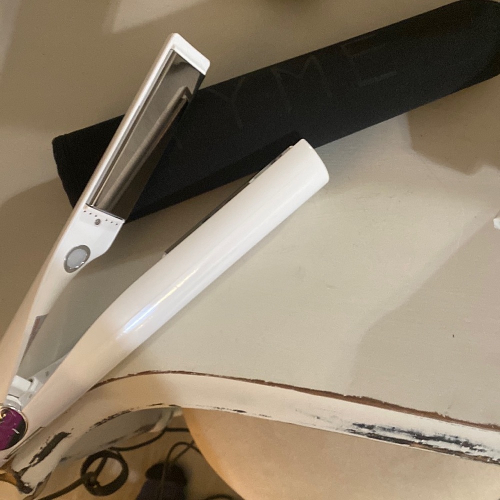 Tyme curling iron. Used once.  Great shape.